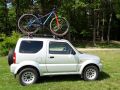 Suzuki Jimny with a roof-mounted bicycle - A01.jpg