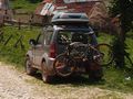 Suzuki Jimny with a bicycle carrier for two bikes on a tow hook, with one bike - A01.jpg