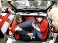 Three people in the back of a small car - A01.jpg